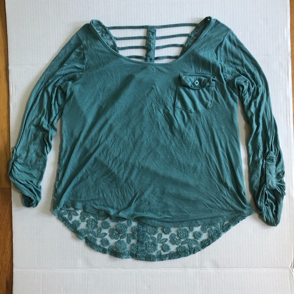 Blue top with lace cutouts and stringy parts